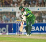 Saeed Ajmal drives a ball