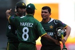 Mohammad Hafeez, Kamran Akmal and Shoaib Malik celebrate after winning the match