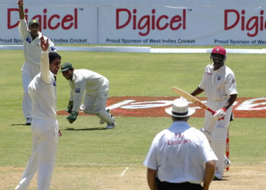 Shabbir Ahmed celebrates with Yasir Hameed