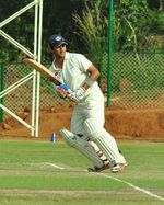 Ian Dev Singh hits a boundary