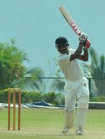 Robert Fernandez hits a boundary