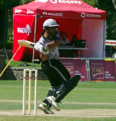 Mohammad Azam hooks a ball to the boundary