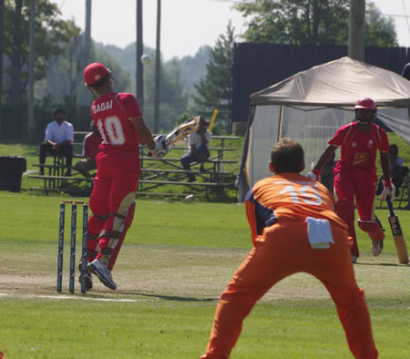 The last ball of Timm van der Gugten's (not in picture) first over rises steeply past Canadian captain Ashish Bagai