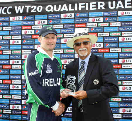 William Porterfield of Ireland receives the MOM award from ICC Match referee Dev Govindjee