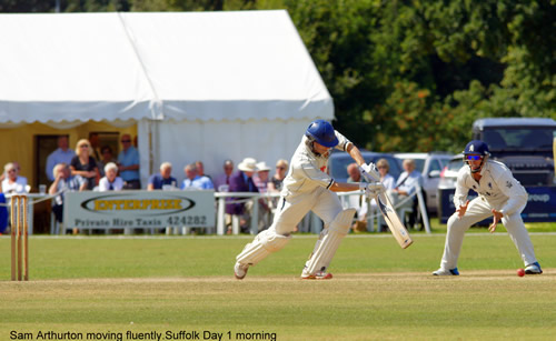 Sam Arthurton moves forward to drive while batting for Norfolk