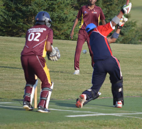 Shayad Ahmed of Quebec attempts a drive against Newfoundland & Labrador