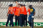 England celebrate after getting the wicket of Kaveen Bandara