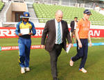 The captains walk out for the all important toss