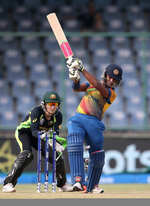 Chamari Atapattu Captain of Sri Lanka hits out with Alyssa Healy of Australia looking on during the Women's ICC World Twenty20