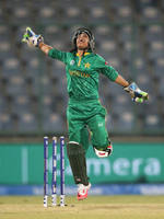 Sidra Nawaz of Pakistan celebrates a catch to dismiss Sanjida Islam of Bangladesh