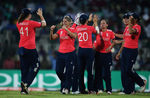 Katherine Brunt of England is congratulated, after she caught Sana Mir, Captain of Pakistan off the bowling of Laura Marsh