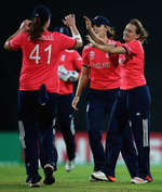 Laura Marsh of England is congratulated on the wicket of Muneeba Ali of Pakistan, after she was caught by Katherine Brunt of England