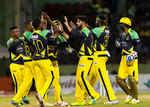 The Tallawahs embrace each other after getting a wicket