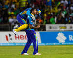 Ravi Rampaul celebrates as the keeper embraces him