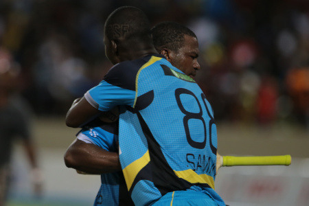 Darren Sammy embraces Johnson Charles