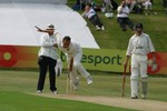 Neil Carter bowls from the Embankment End