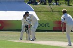 David Harrison blocks out a ball from Dougie Brown