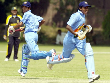 Diana David (L) and Anagha Deshpande (R) run between wickets