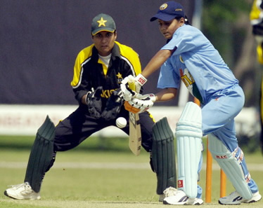 Karuna Jain drives a ball