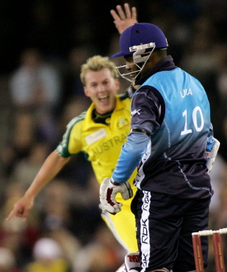 Brian Lara (R) looks dejected after edging a ball for a golden duck