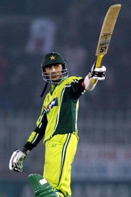 Yasir Hameed raises his bat after his half century