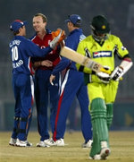 Shaun Udal celebrates with teammates after taking a wicket