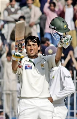 Younis Khan waves his bat after his century