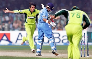 Mohammad Asif celebrates after taking a wicket