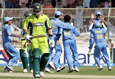 Kamran Akmal walks back to the pavilion