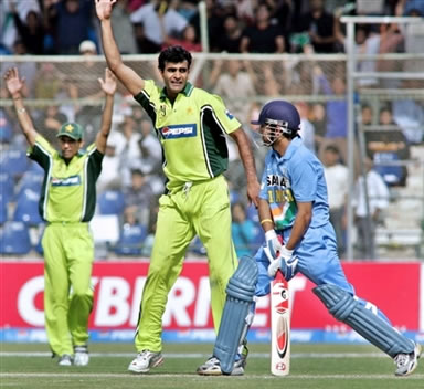 Iftikhar Anjum celebrates after taking the wicket