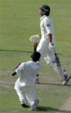 Younis Khan walks back to the pavilion