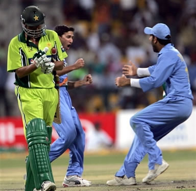 Younis Khan walks back to the pavilion