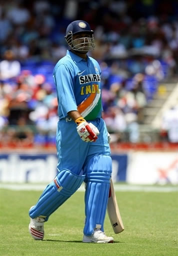 Sehwag walks back to the pavilion