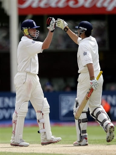 Flintoff celebrates with Cook after their victory