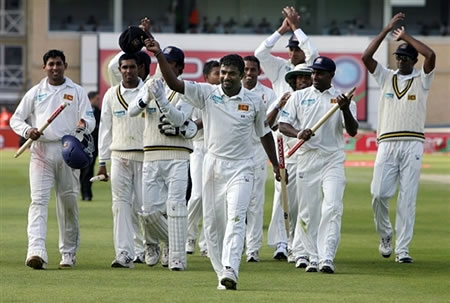 Muralitharan celebrates after taking eight wickets