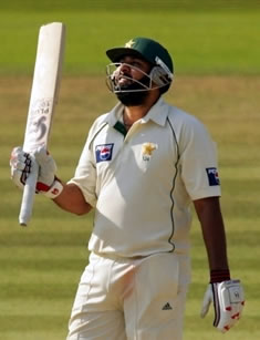 Inzamam-ul-Haq raises his bat after his half century